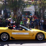 Mr. Harold Davis, the oldest veteran in Jacksonville in a yellow Corvette
