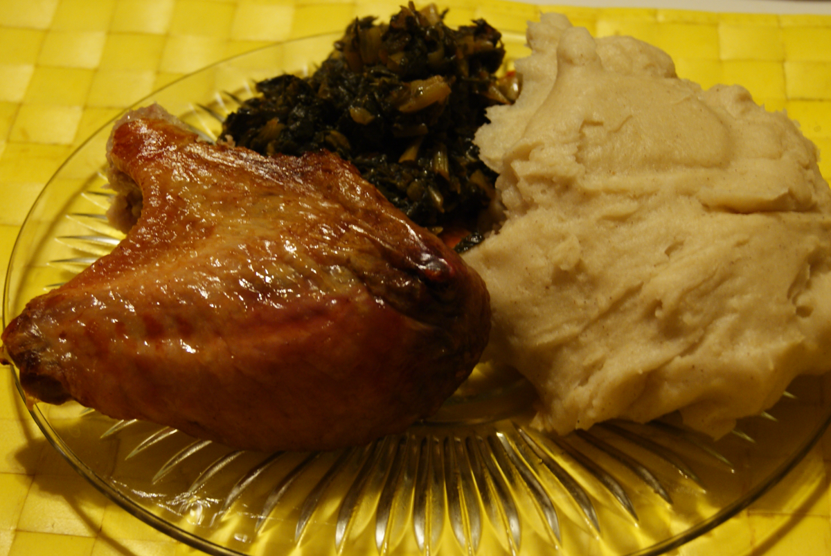 My thanksgiving plate with a turkey wing, fufu, and collard green.